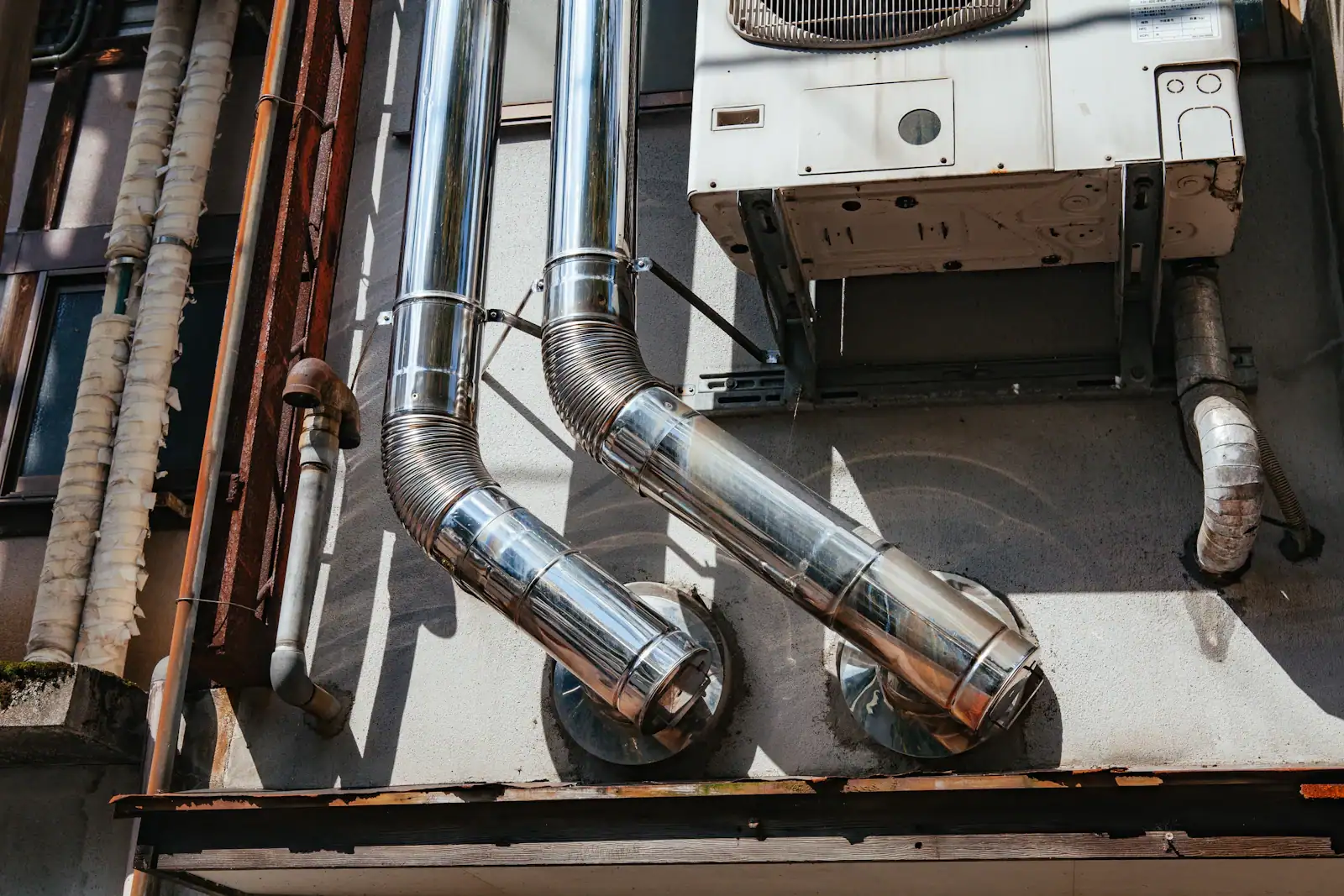 Ducts and refrigerant lines running to an outdoor air conditioner