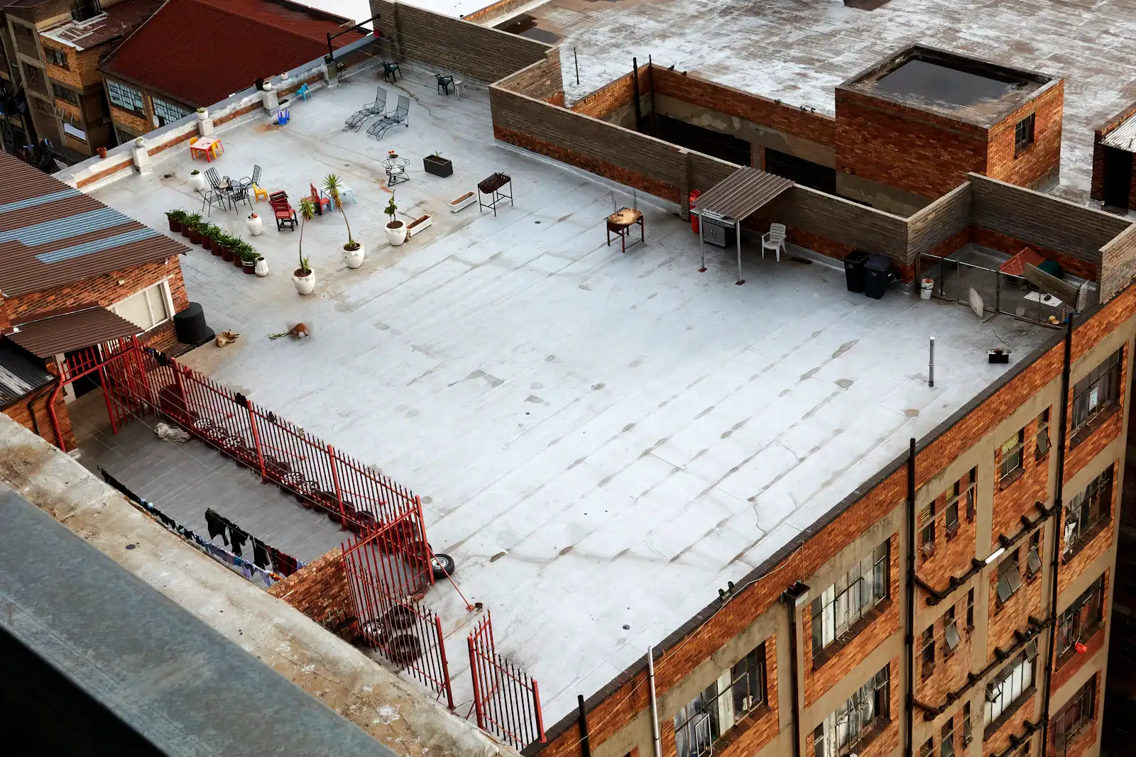 Flat roofs covered in snow seen from above