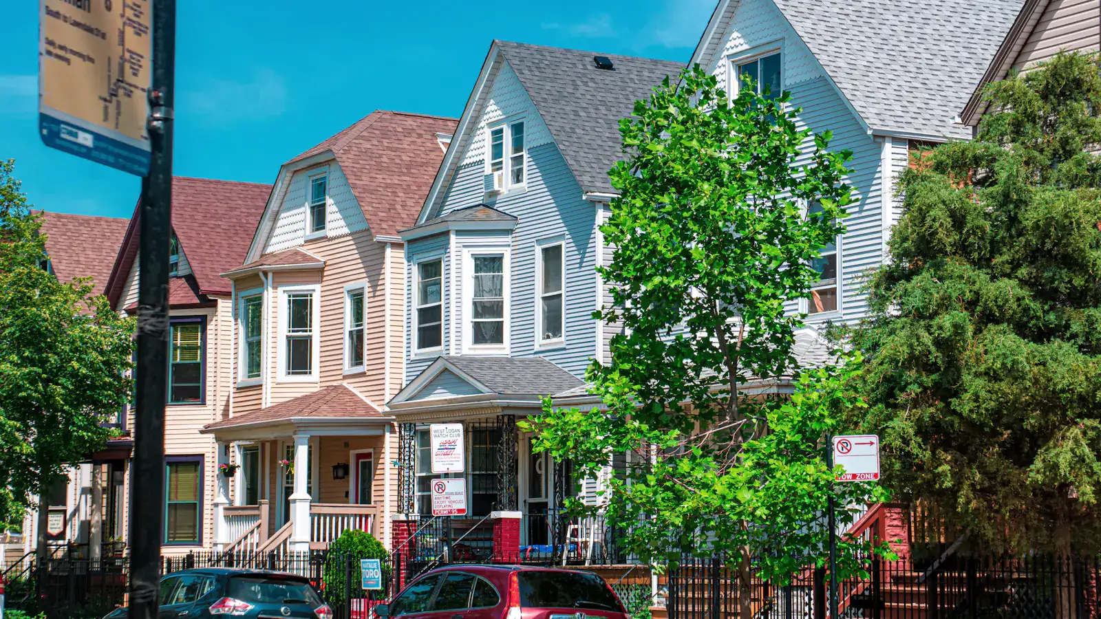 A row of frame houses on a Chicago street at Kimball and Homan