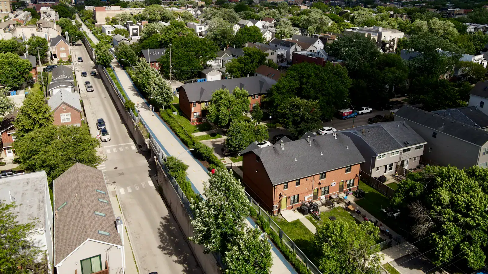 Logan Square houses and flat roofs with the Chicago skyline behind